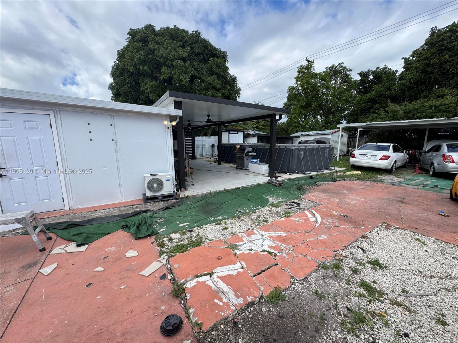 879 East 28th Street, Unit 879 Hialeah, FL 33013 - Photo 12 of 12 a view of a backyard with furniture