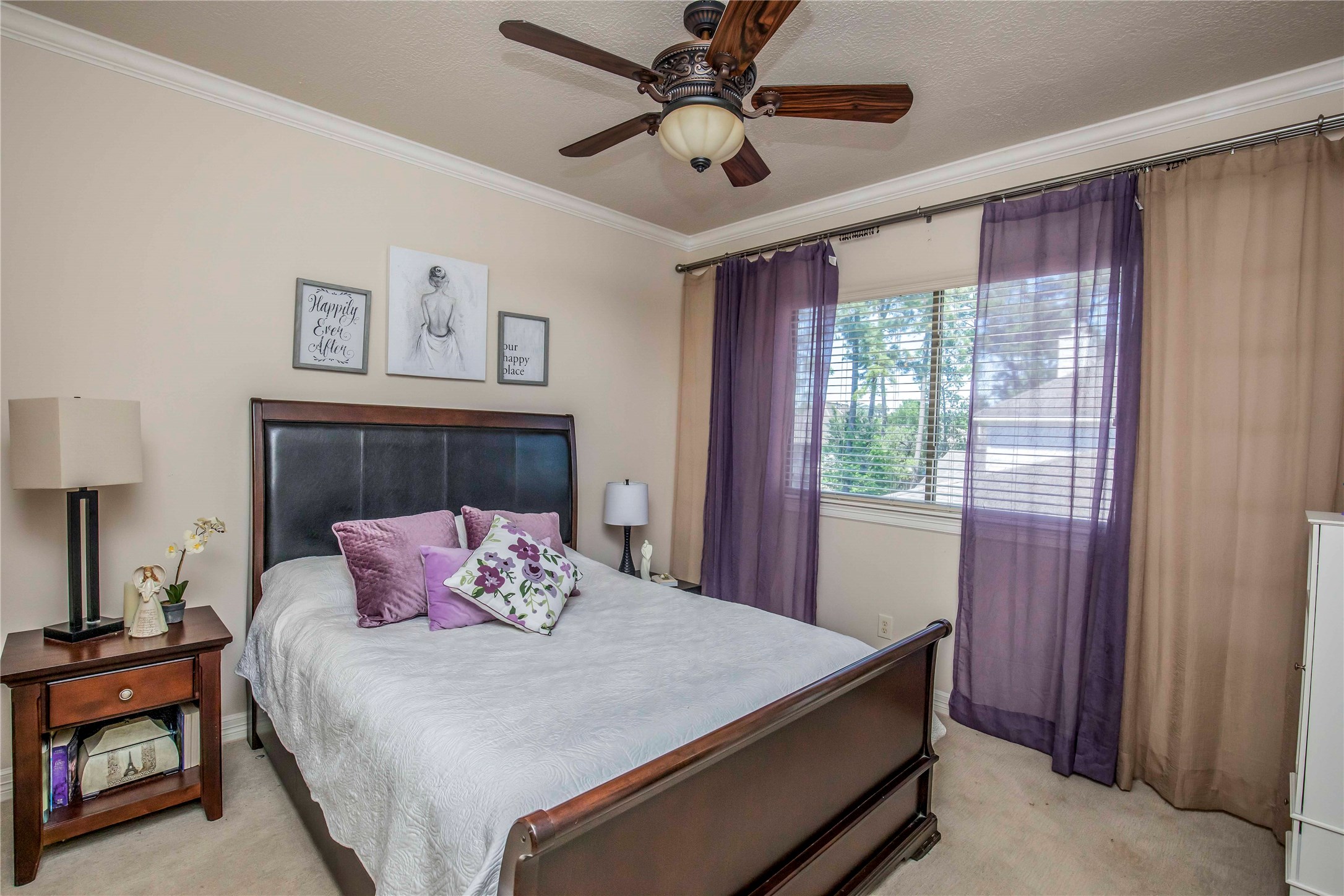 25219 Hideaway Run Drive Spring, TX 77389 - Photo 41 of 45 a bedroom with a bed and a chandelier