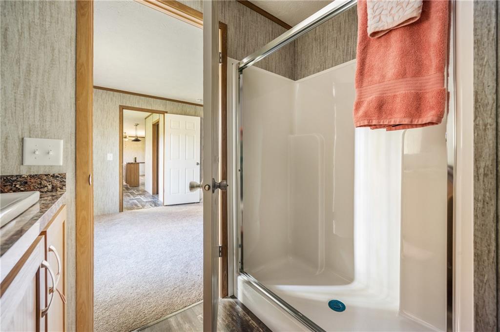 69 South Summit Road, Unit 102 Greenville, PA 16125 - Photo 18 of 24 a view of a bathroom with a tub and shower