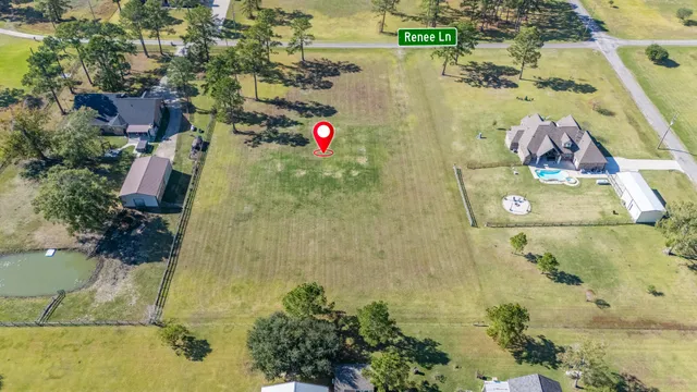 an aerial view of residential house with outdoor space