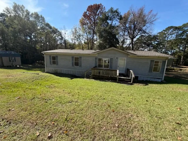 a house with trees in the background
