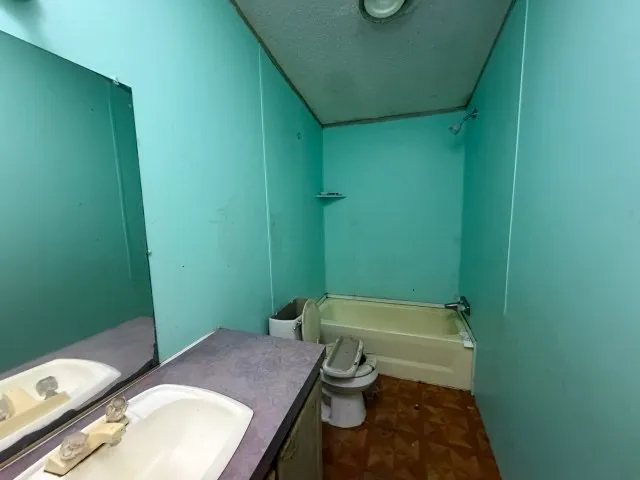 a bathroom with a sink and toilet