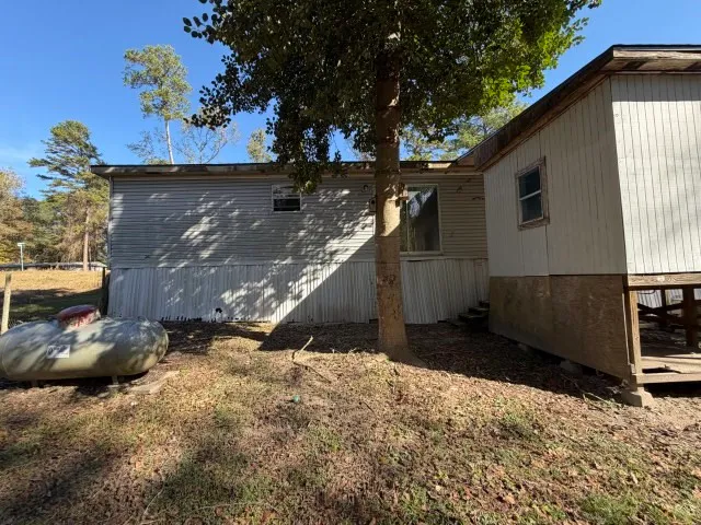 a view of a backyard of the house