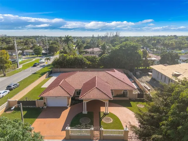 a aerial view of a house with a ocean view