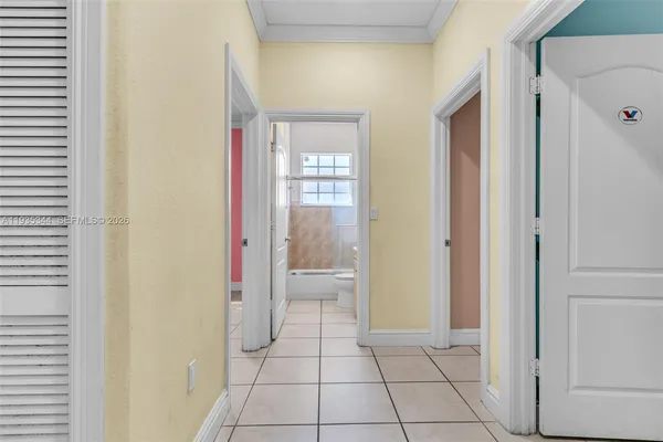 a bathroom with a granite countertop sink a toilet and a shower