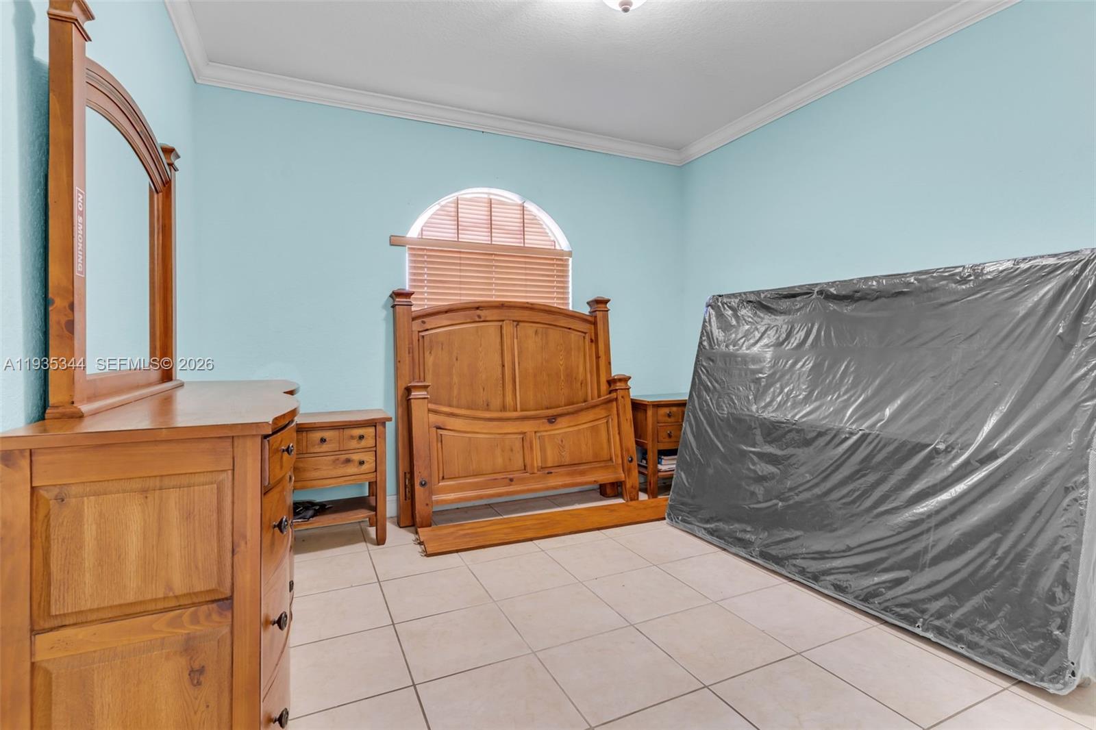 12700 Southwest 188th Street Miami, FL 33177 - Photo 22 of 44 a bedroom with a bed and a dresser