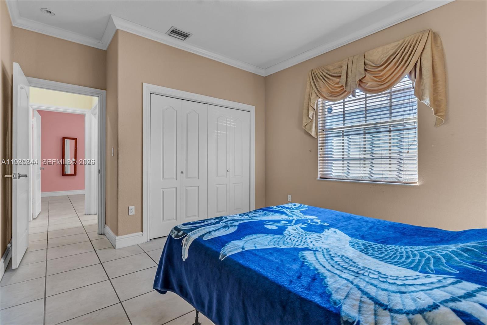 12700 Southwest 188th Street Miami, FL 33177 - Photo 27 of 44 a bedroom with a bed and a window