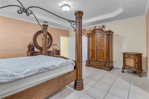 a bathroom with a tub shower and mirror