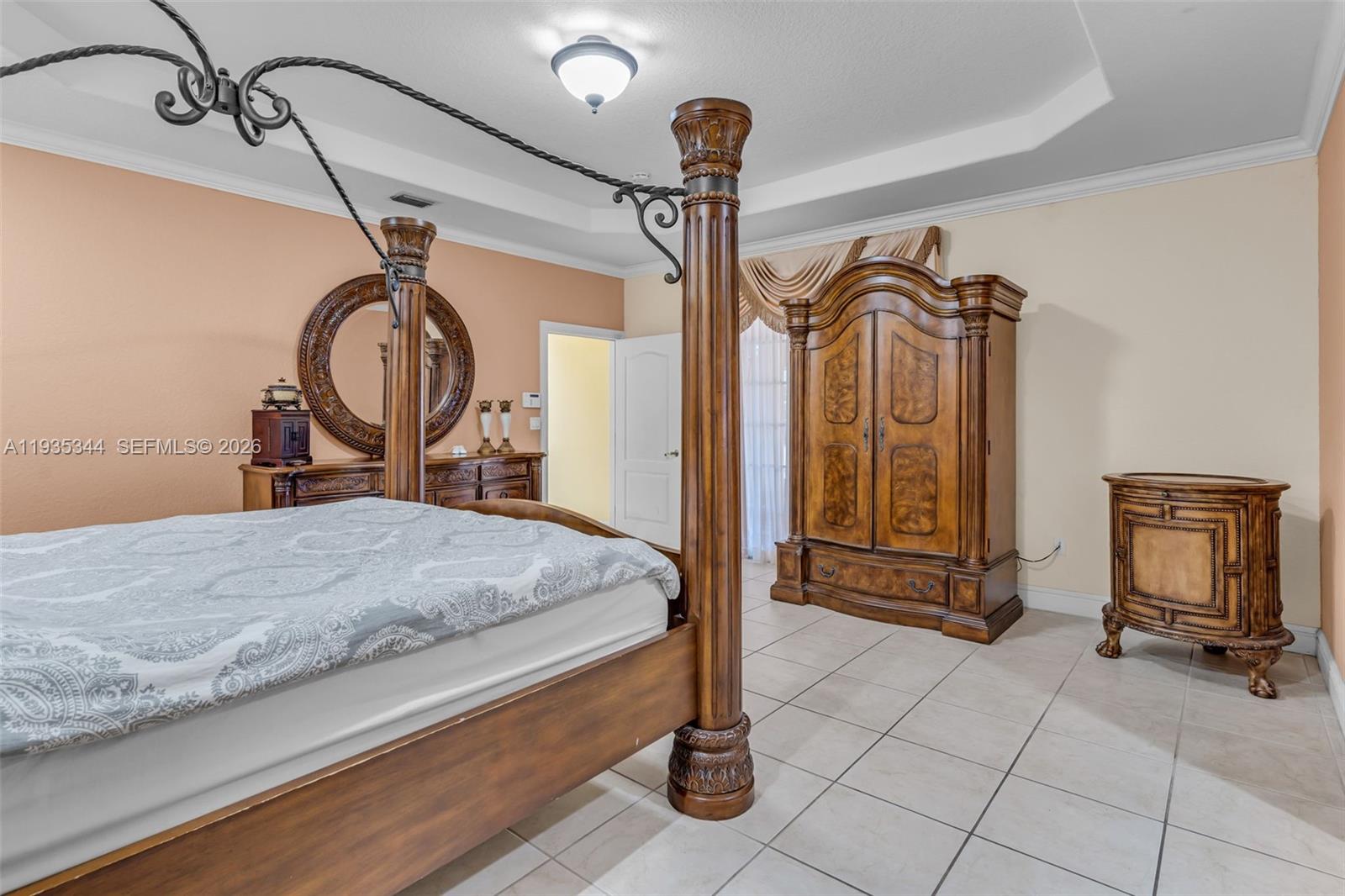 12700 Southwest 188th Street Miami, FL 33177 - Photo 29 of 44 a bedroom with a bed and a mirror