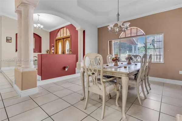 a view of a dining room with furniture window and outside view