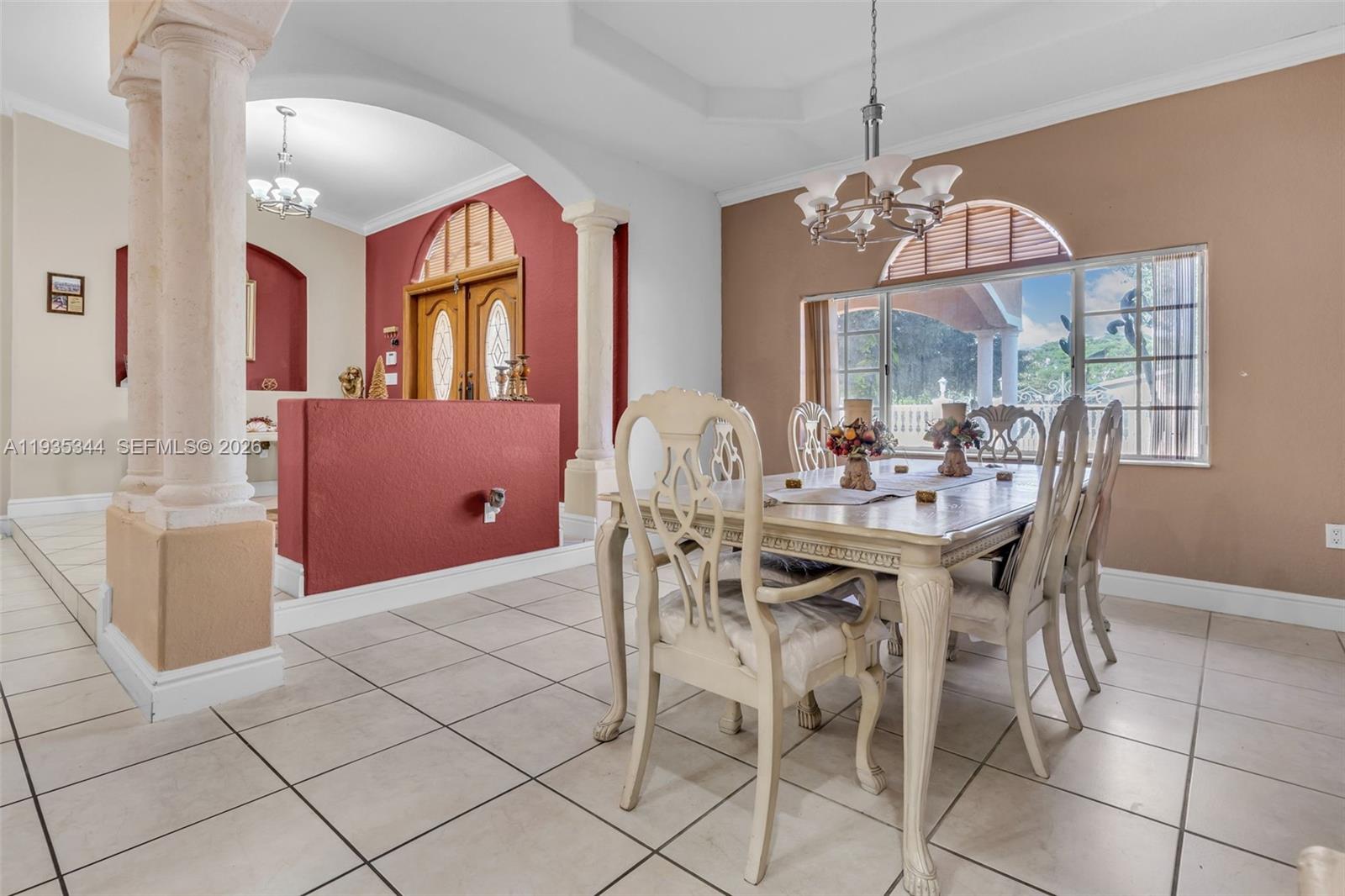 12700 Southwest 188th Street Miami, FL 33177 - Photo 9 of 44 a view of a dining room with furniture window and outside view