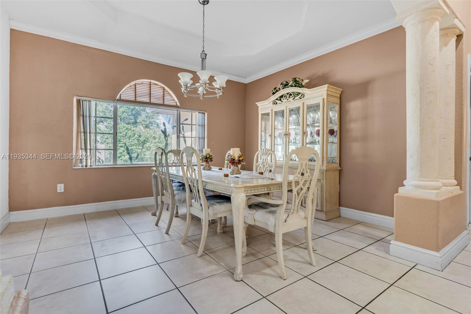 12700 Southwest 188th Street Miami, FL 33177 - Photo 10 of 44 a view of a dining room with furniture window and outside view