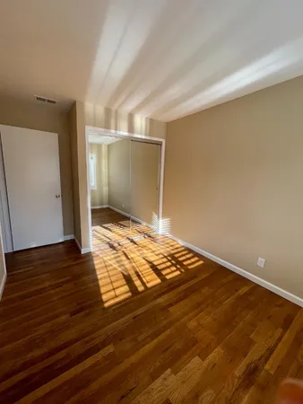 a view of a livingroom with wooden floor