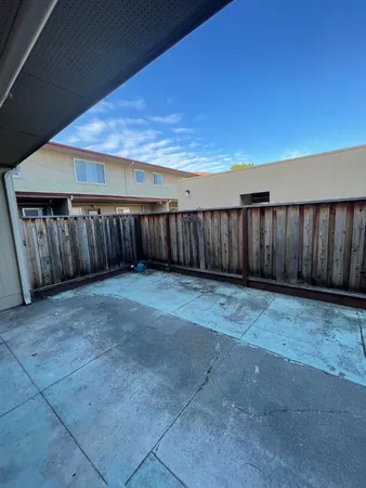 a view of building with trees in the background