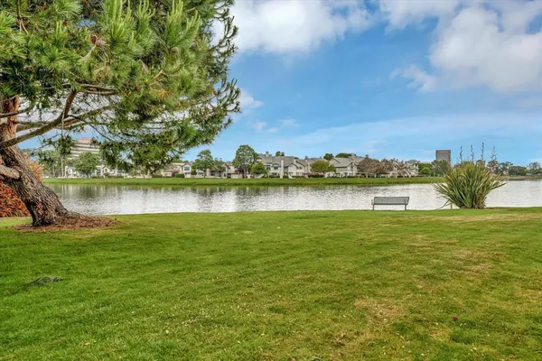 a view of a swimming pool with an outdoor space and seating area