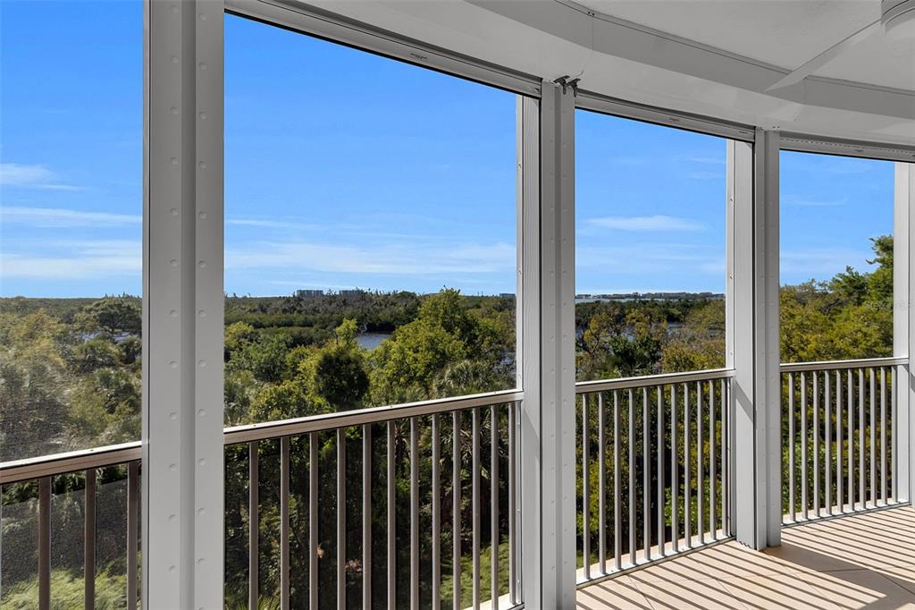 393 North Point Road, Unit 401 Osprey, FL 34229 - Photo 20 of 62 a view of a balcony with wooden floor