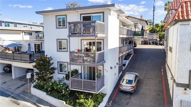 an aerial view of a city with ocean view