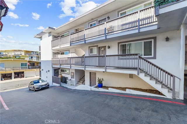 a view of pool with a car parked in front of it