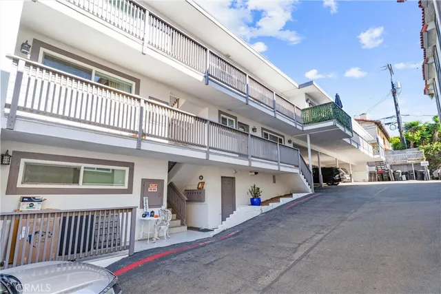 a view of a porch with a table and chairs