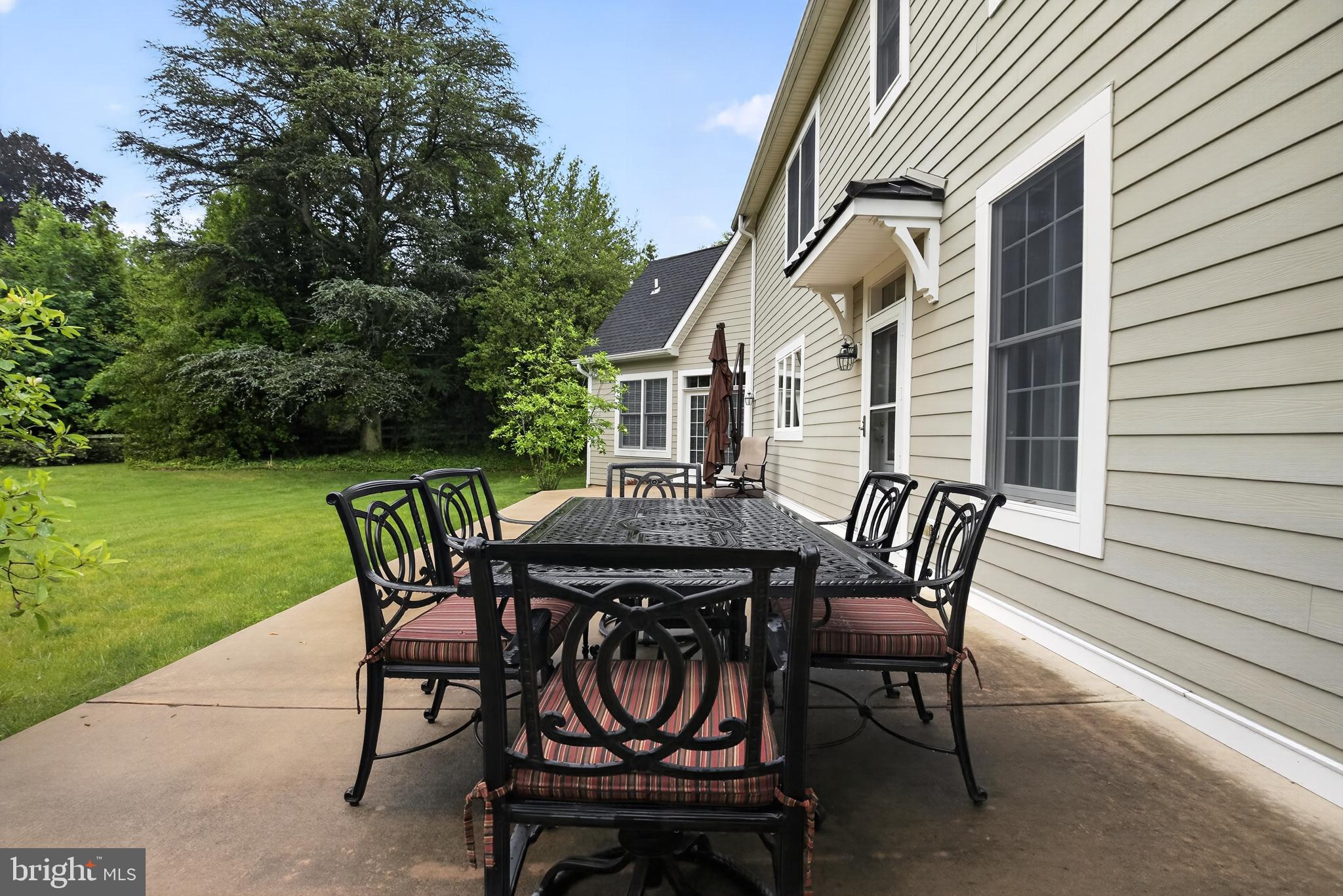 1031 Coates Road Jenkintown, PA 19046 - Photo 47 of 66 a view of a patio with table and chairs with plants and wooden fence