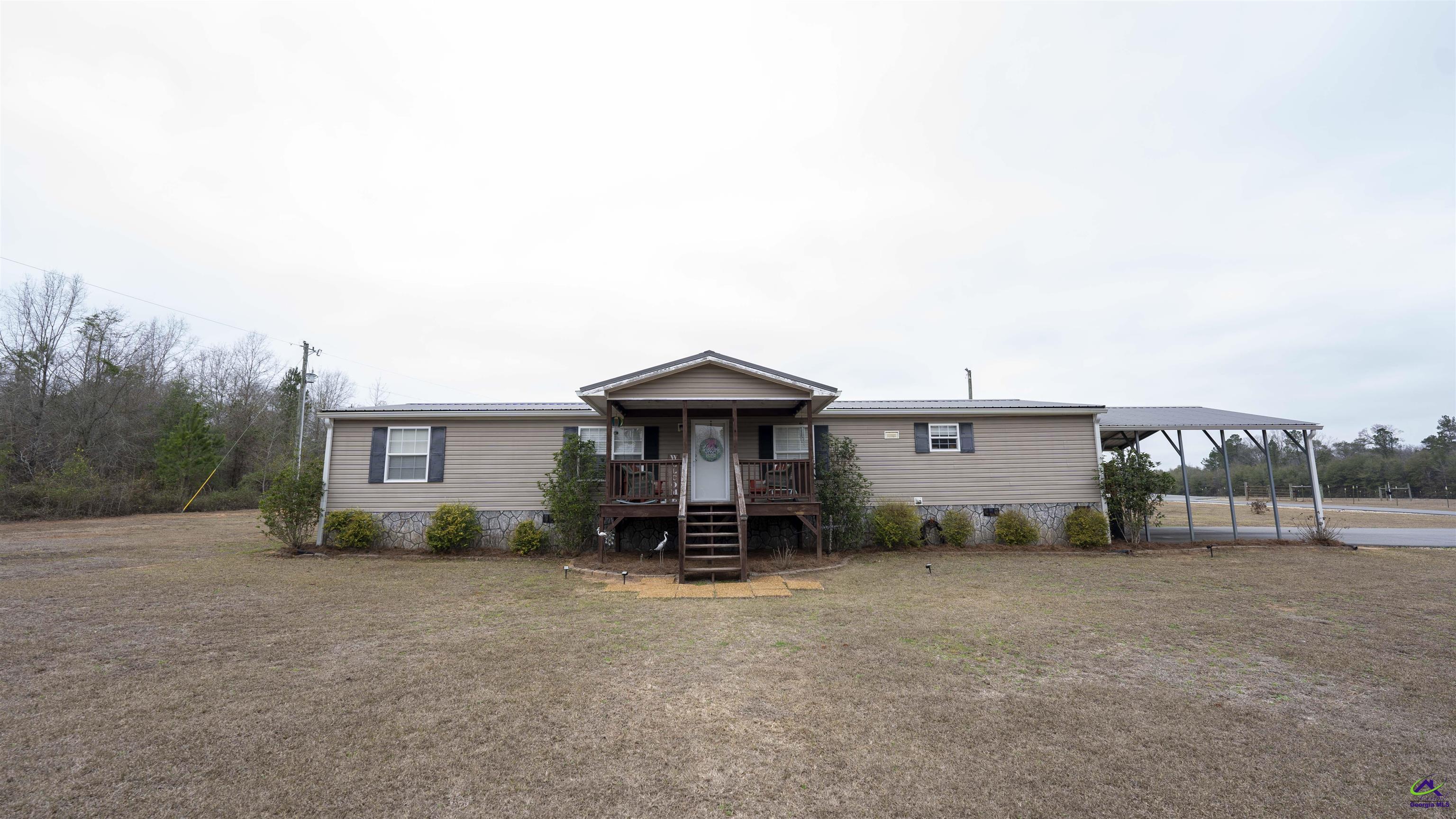 500 Old Milledgeville Road Cochran, GA 31014 - Photo 26 of 48 a view of a house with backyard
