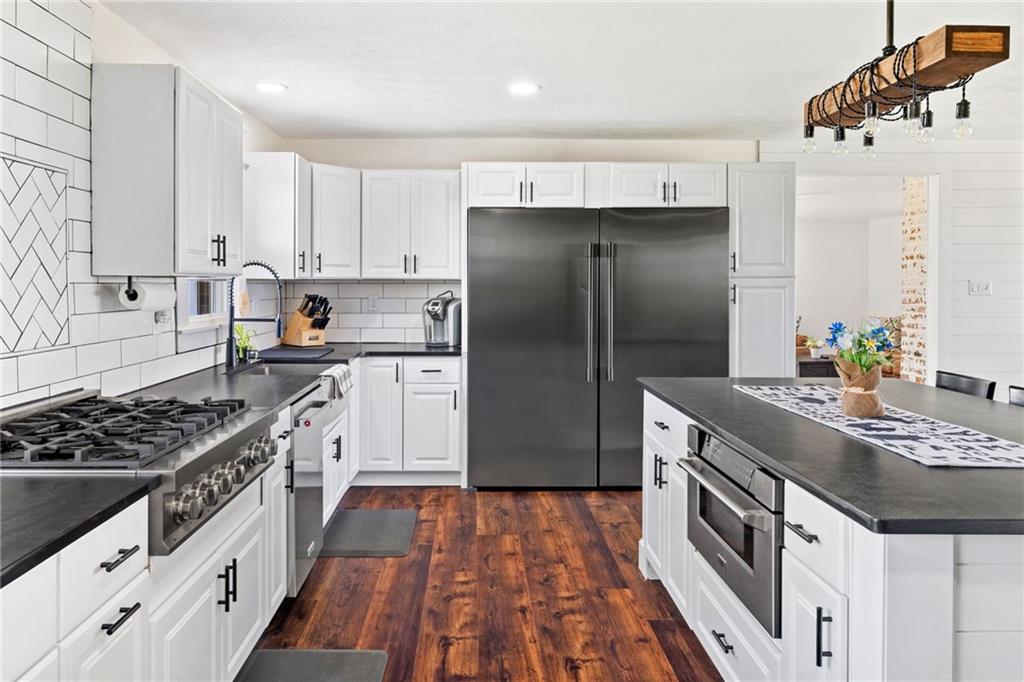 967 Good Intent Road Claysville, PA 15323 - Photo 13 of 50 a kitchen with stainless steel appliances granite countertop a stove a sink and a refrigerator