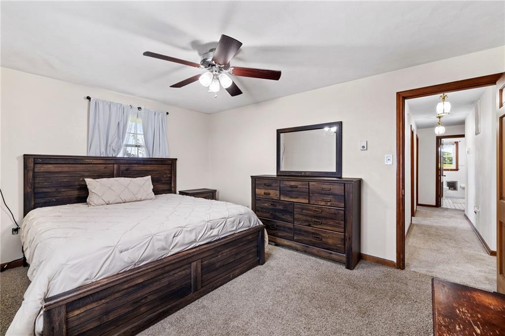 967 Good Intent Road Claysville, PA 15323 - Photo 19 of 50 a bedroom with a bed and a chandelier
