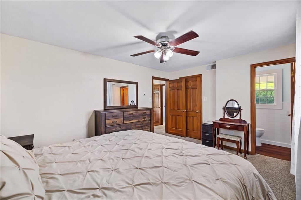 967 Good Intent Road Claysville, PA 15323 - Photo 20 of 50 a bedroom with a bed and a chandelier