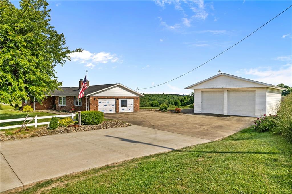 967 Good Intent Road Claysville, PA 15323 - Photo 2 of 50 a front view of a house with a yard and garage