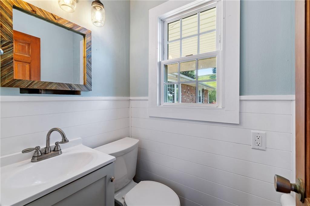 967 Good Intent Road Claysville, PA 15323 - Photo 21 of 50 a bathroom with a toilet sink vanity and mirror