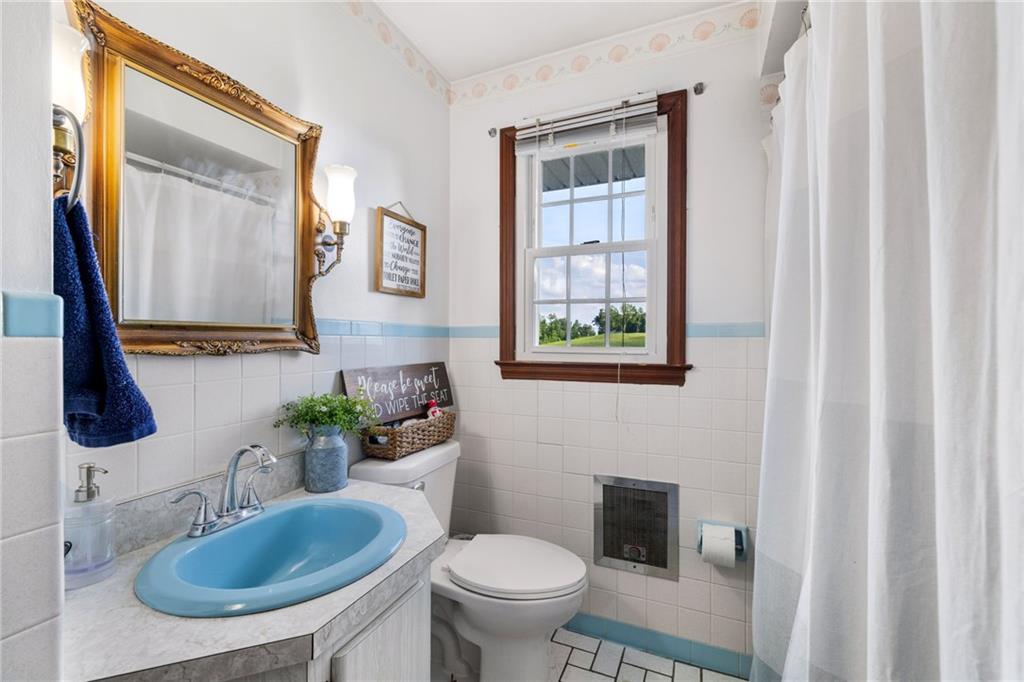967 Good Intent Road Claysville, PA 15323 - Photo 26 of 50 a bathroom with a toilet sink and mirror