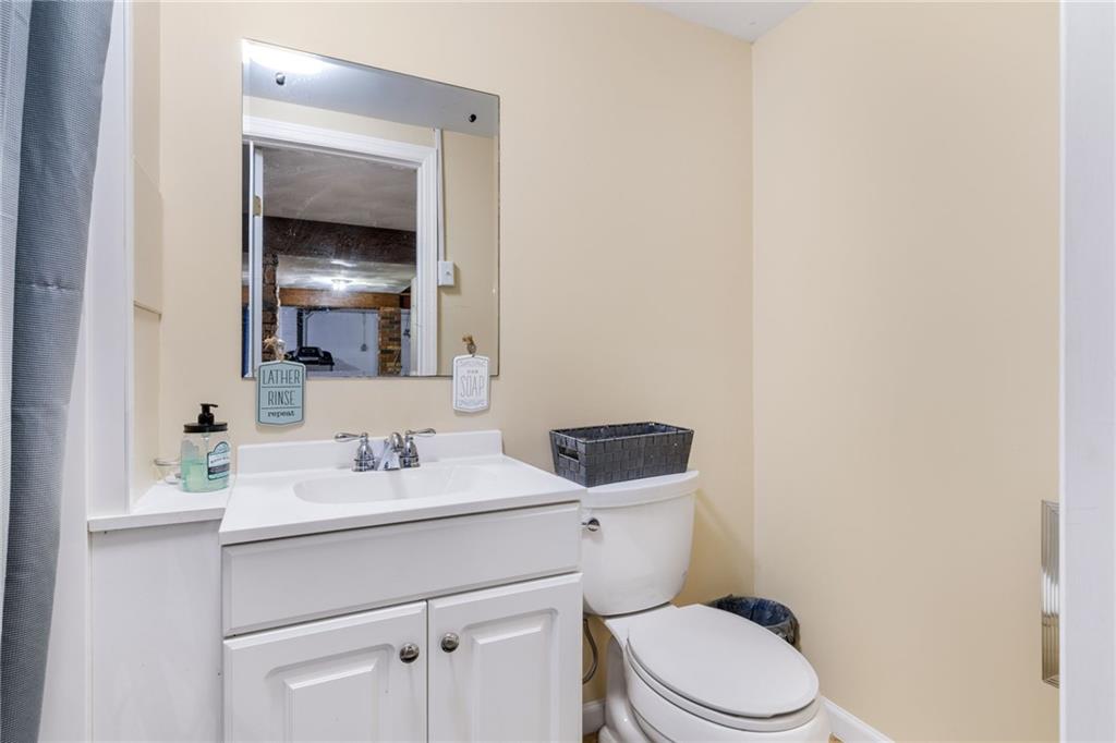 967 Good Intent Road Claysville, PA 15323 - Photo 30 of 50 a bathroom with a toilet sink vanity and mirror