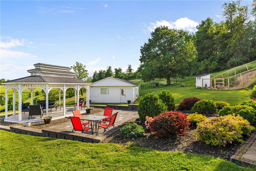 967 Good Intent Road Claysville, PA 15323 - Photo 34 of 50 a view of a house with backyard sitting area and garden