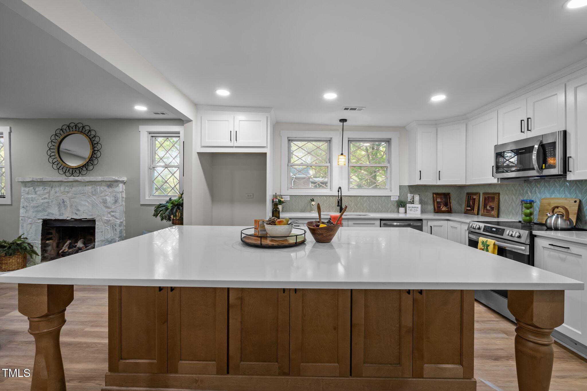 3014 Hope Valley Road Durham, NC 27707 - Photo 11 of 38 a kitchen with a table chairs sink and cabinets