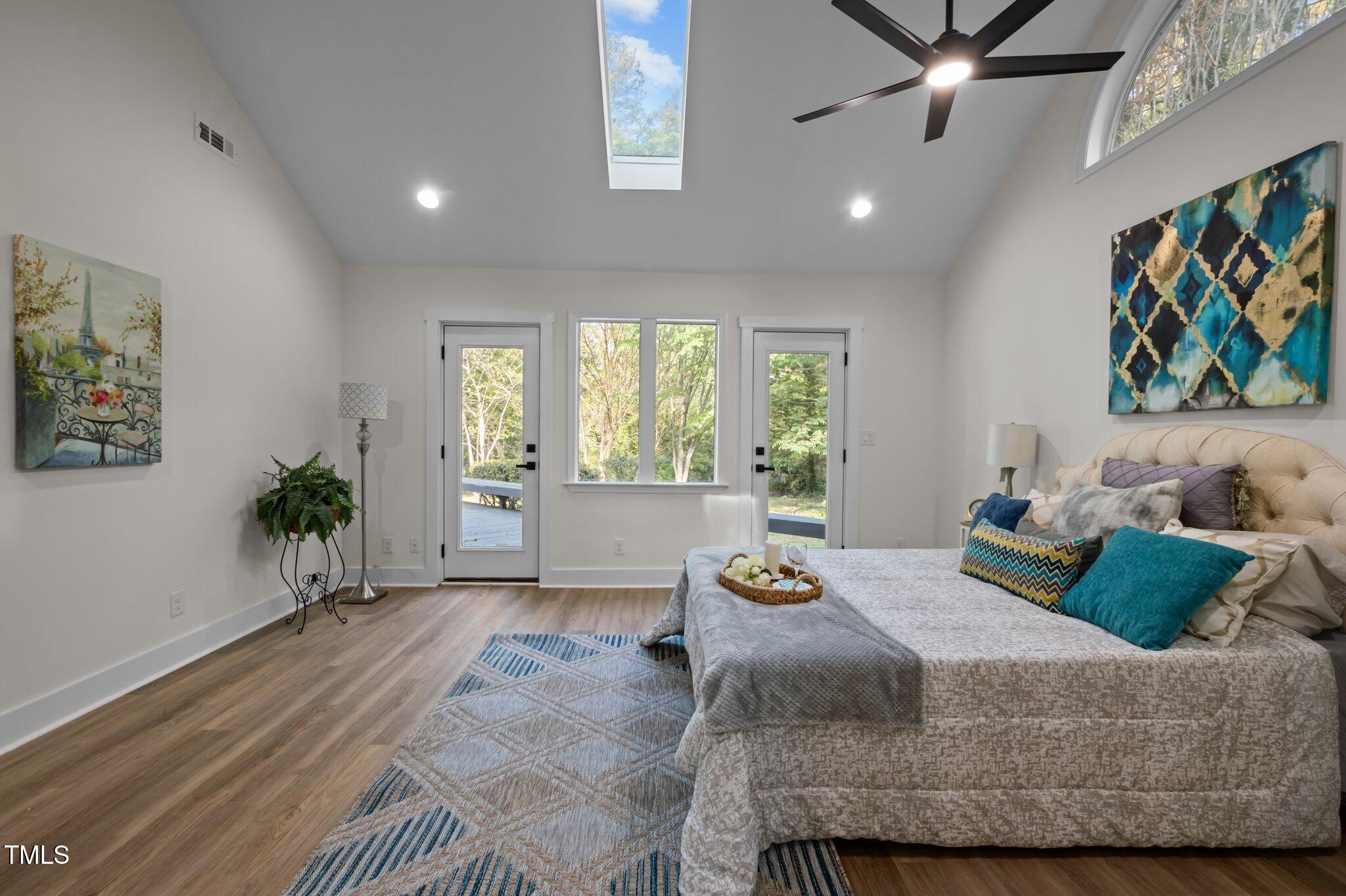 3014 Hope Valley Road Durham, NC 27707 - Photo 15 of 38 a bedroom with a bed and a painting on the wall
