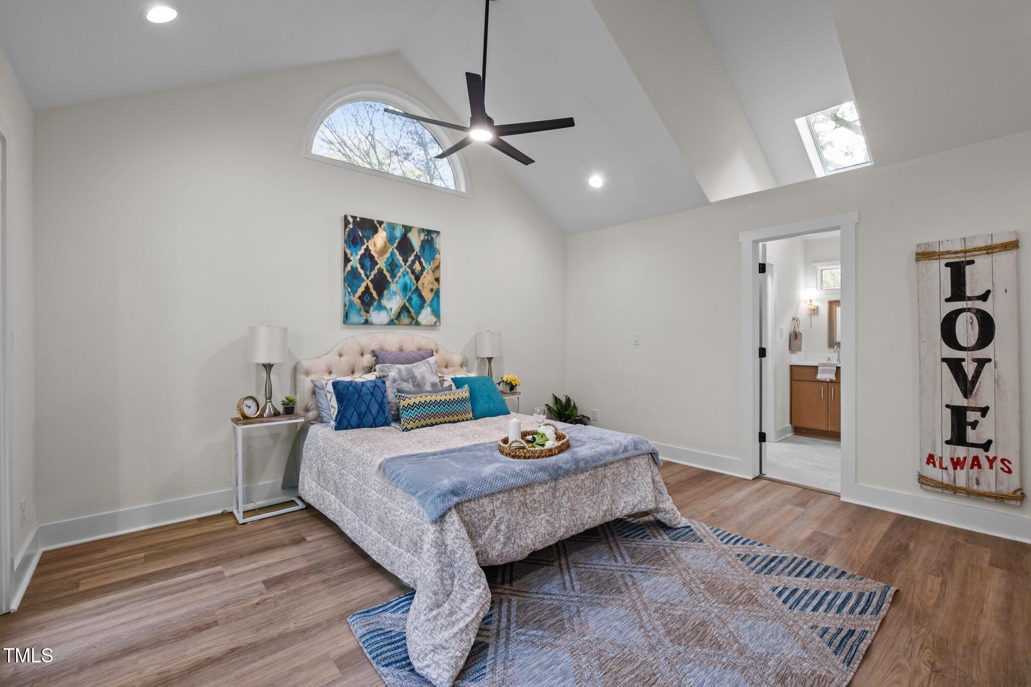3014 Hope Valley Road Durham, NC 27707 - Photo 16 of 38 a bedroom with a bed and a chandelier