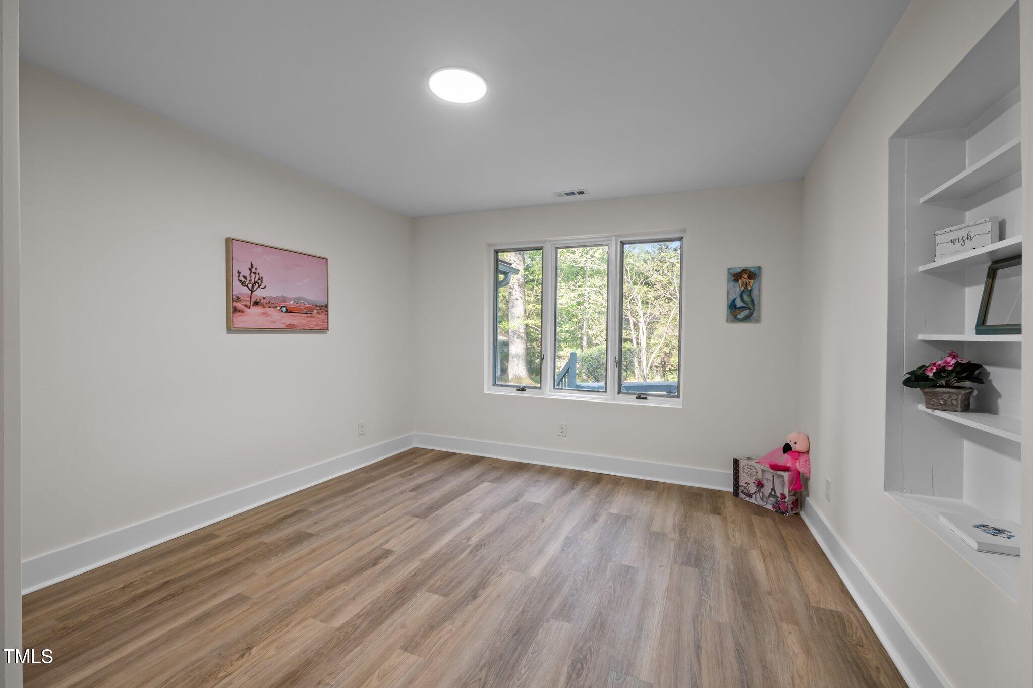 3014 Hope Valley Road Durham, NC 27707 - Photo 24 of 38 wooden floor in an empty room with a window
