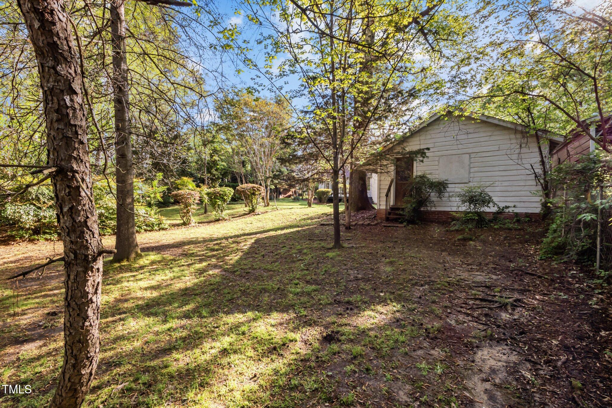 3014 Hope Valley Road Durham, NC 27707 - Photo 31 of 38 a backyard of a house with lots of green space