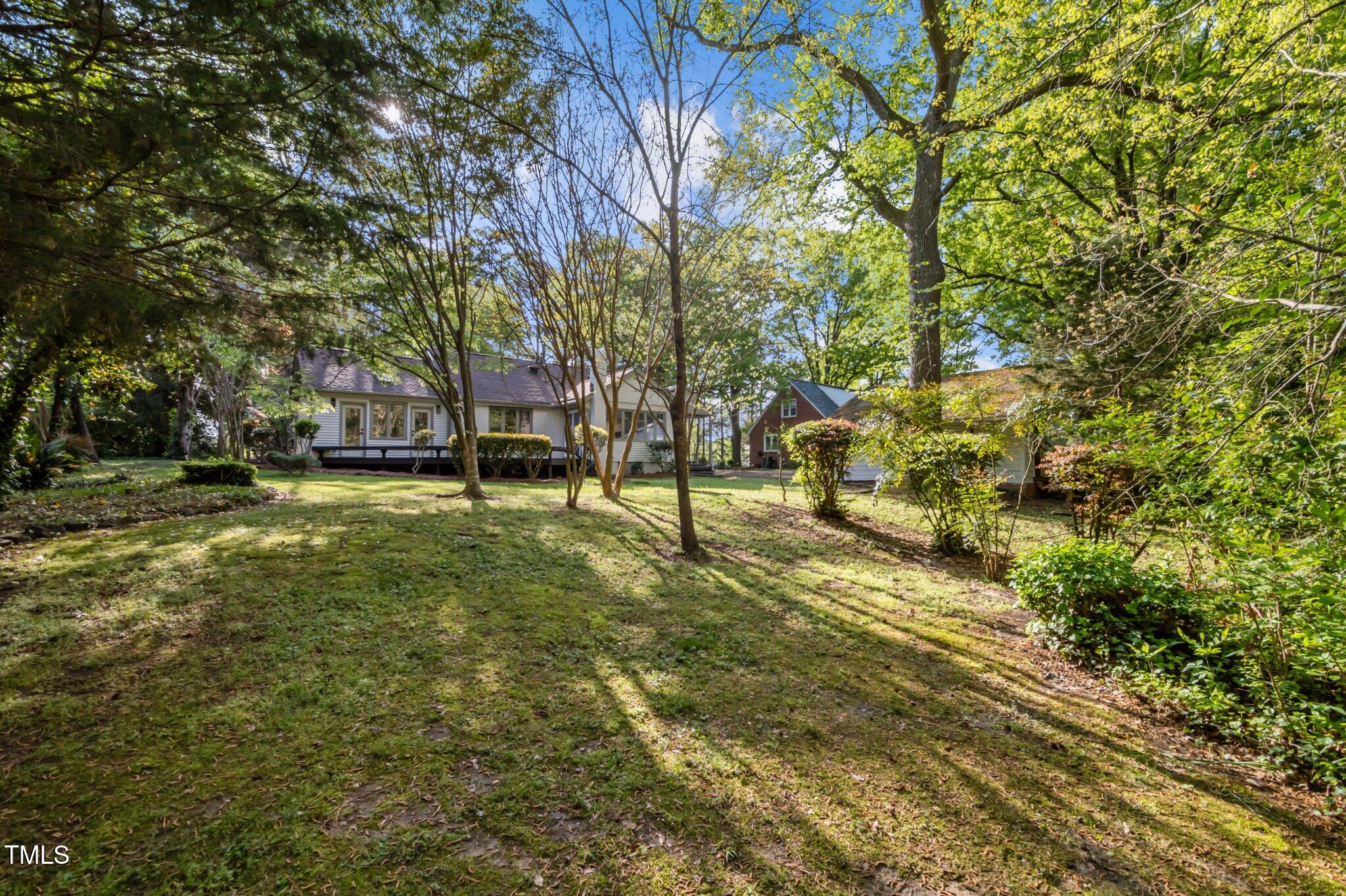 3014 Hope Valley Road Durham, NC 27707 - Photo 33 of 38 a view of yard with swimming pool and trees