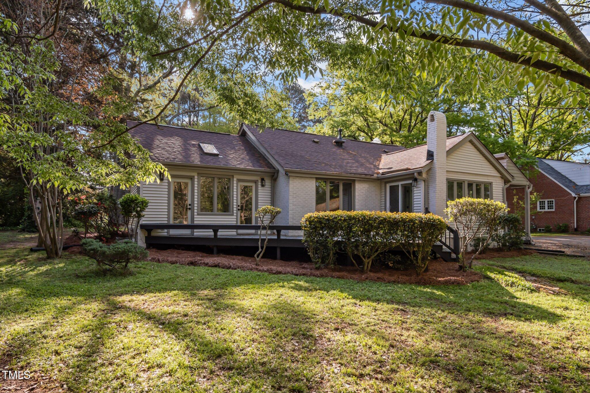 3014 Hope Valley Road Durham, NC 27707 - Photo 34 of 38 a front view of a house with a garden and trees