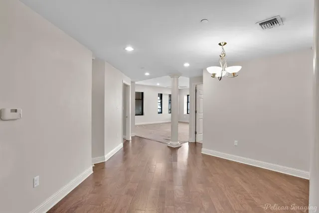 a view of a livingroom with wooden floor