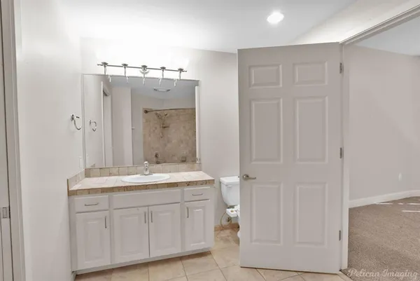 a bathroom with a tub and a shower