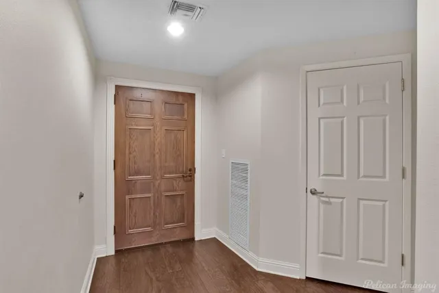 a view of entryway with wooden floor