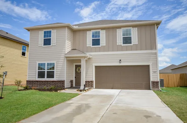 a kitchen with sink stove microwave and cabinets