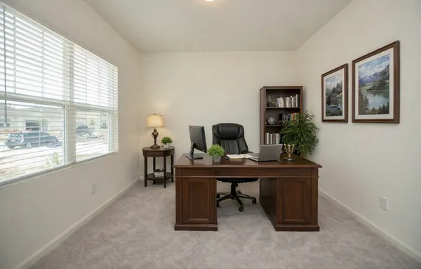 a view of a workspace with furniture