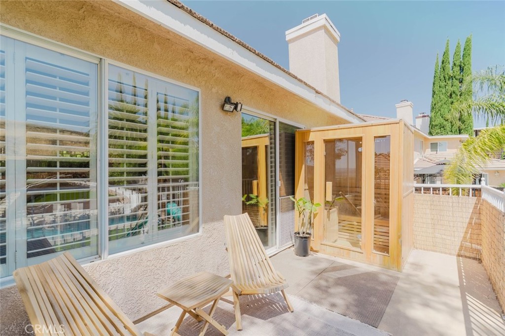 32480 The Old Road Castaic, CA 91384 - Photo 51 of 68 a view of a patio with a table and chairs and potted plants