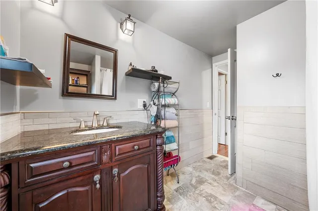 a bathroom with a sink and a mirror
