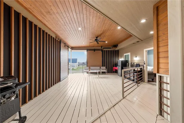 a view of a patio with wooden floor