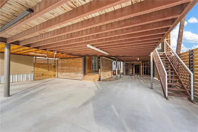 a view of an empty room with wooden roof