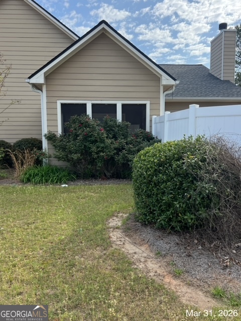 10 Winged Foot Way Southeast Covington, GA 30014 - Photo 2 of 12 a front view of a house with garden